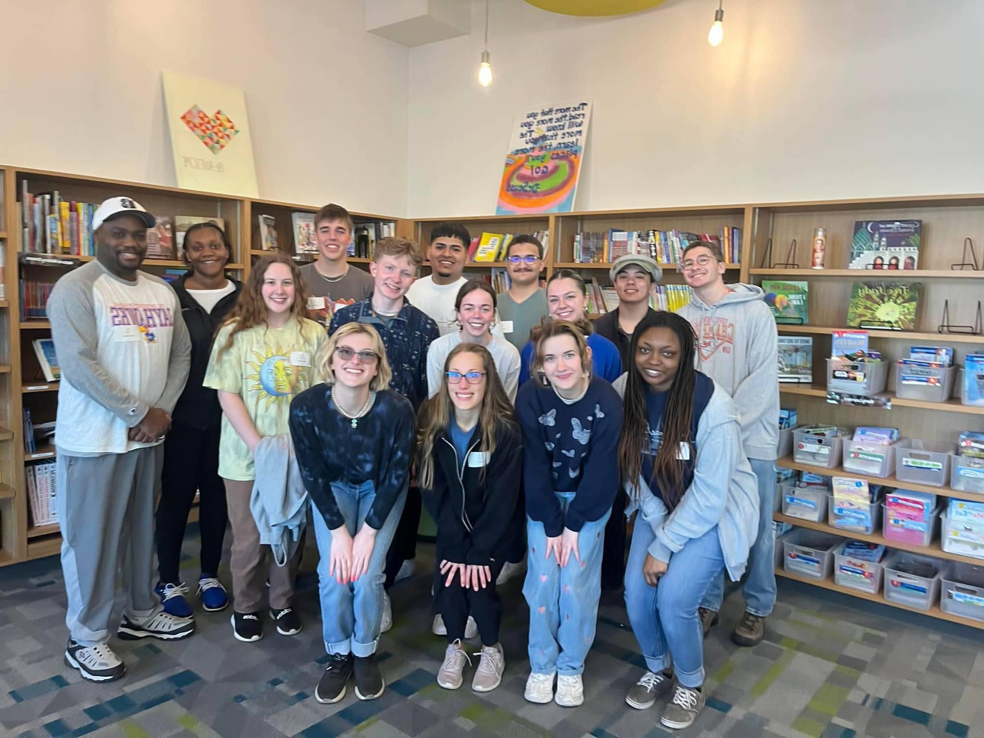 SLAM trip group photo with Quincy Williams and students